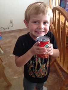boy holding a can