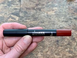 hand holding doucce red lip crayon