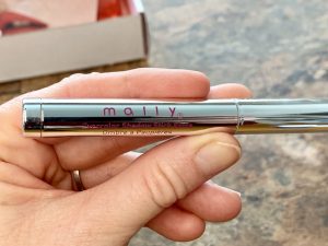 hand holding mally shadow stick