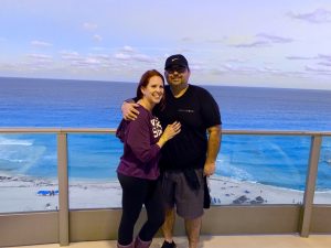 couple standing on balcony