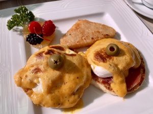 Eggs Benedict with poached eggs and hollandaise sauce