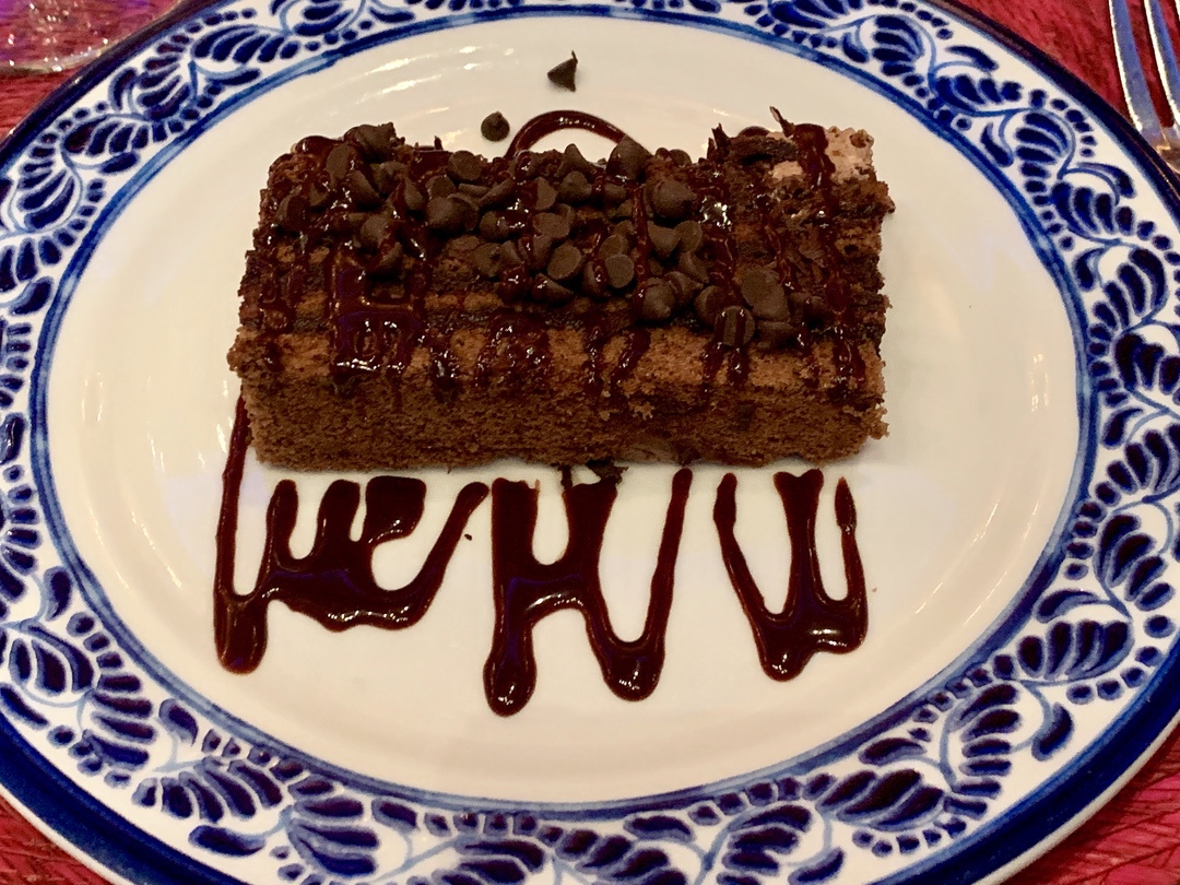 Chocolate cake with chocolate chips and chocolate sauce