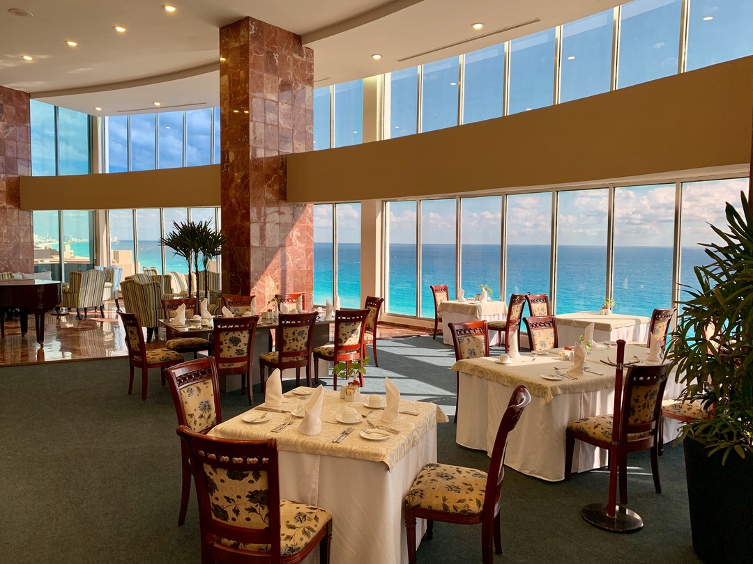 tables in a restaurant with ocean view