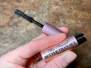 hand holding mascara