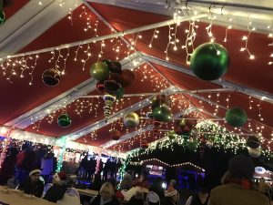 A group of people in tent at christmas
