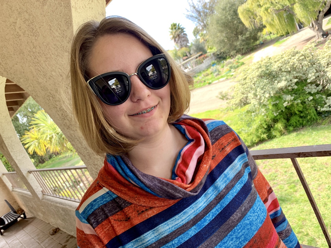 teen girl wearing sunglasses from FabFitFun box