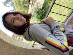 teen girl smiling with backpack