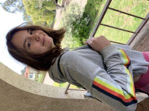 teen girl smiling with backpack