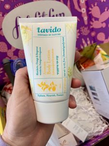 hand holding a tube of beauty product