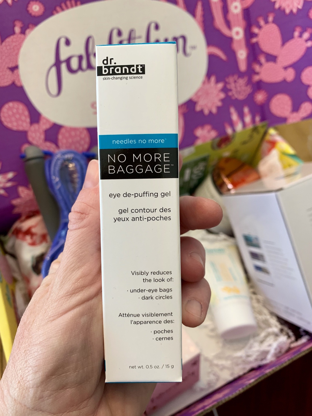 hand holding a box of beauty product