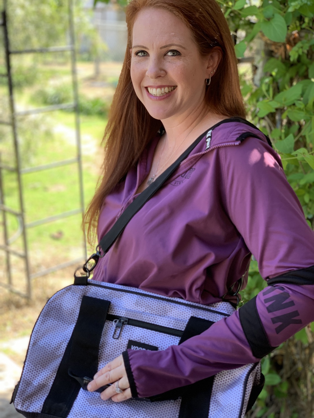 Woman holding duffel bag