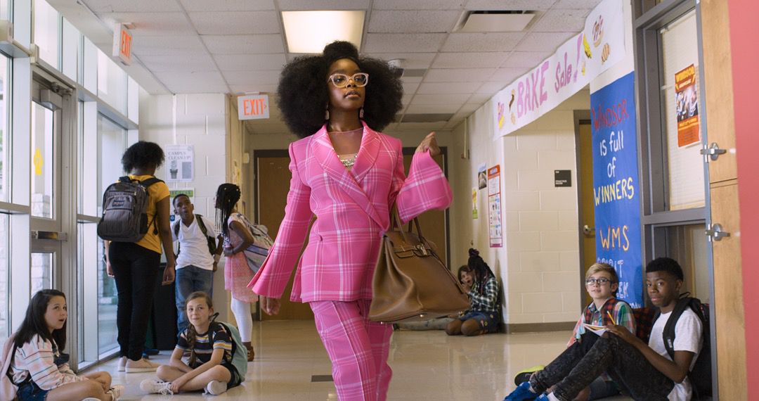 Girl with glasses in pink pants outfit