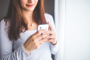 mom texting hand Bright by Text