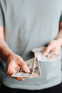 RebatesMe hand holding money