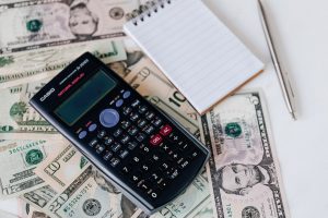 money with calculator and notepad