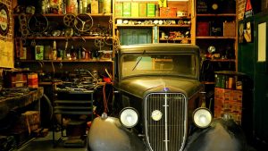 car in garage with tools