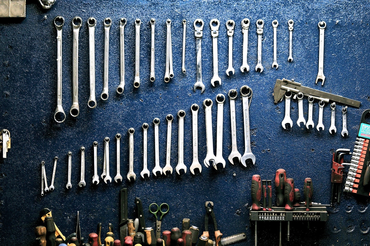 tools hanging in garage near toolbench