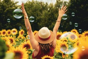happy woman in flowers