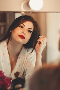 woman applying makeup