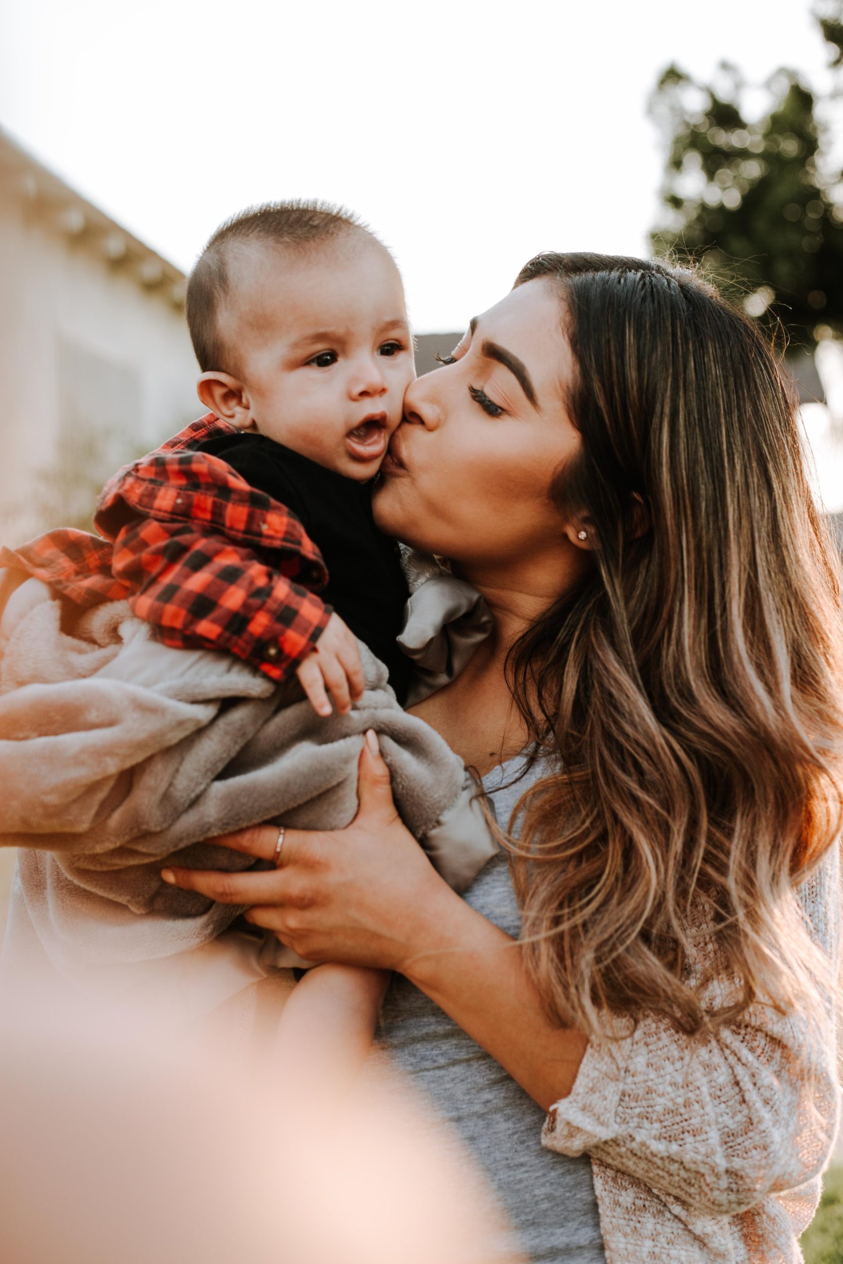Mom kissing baby boy