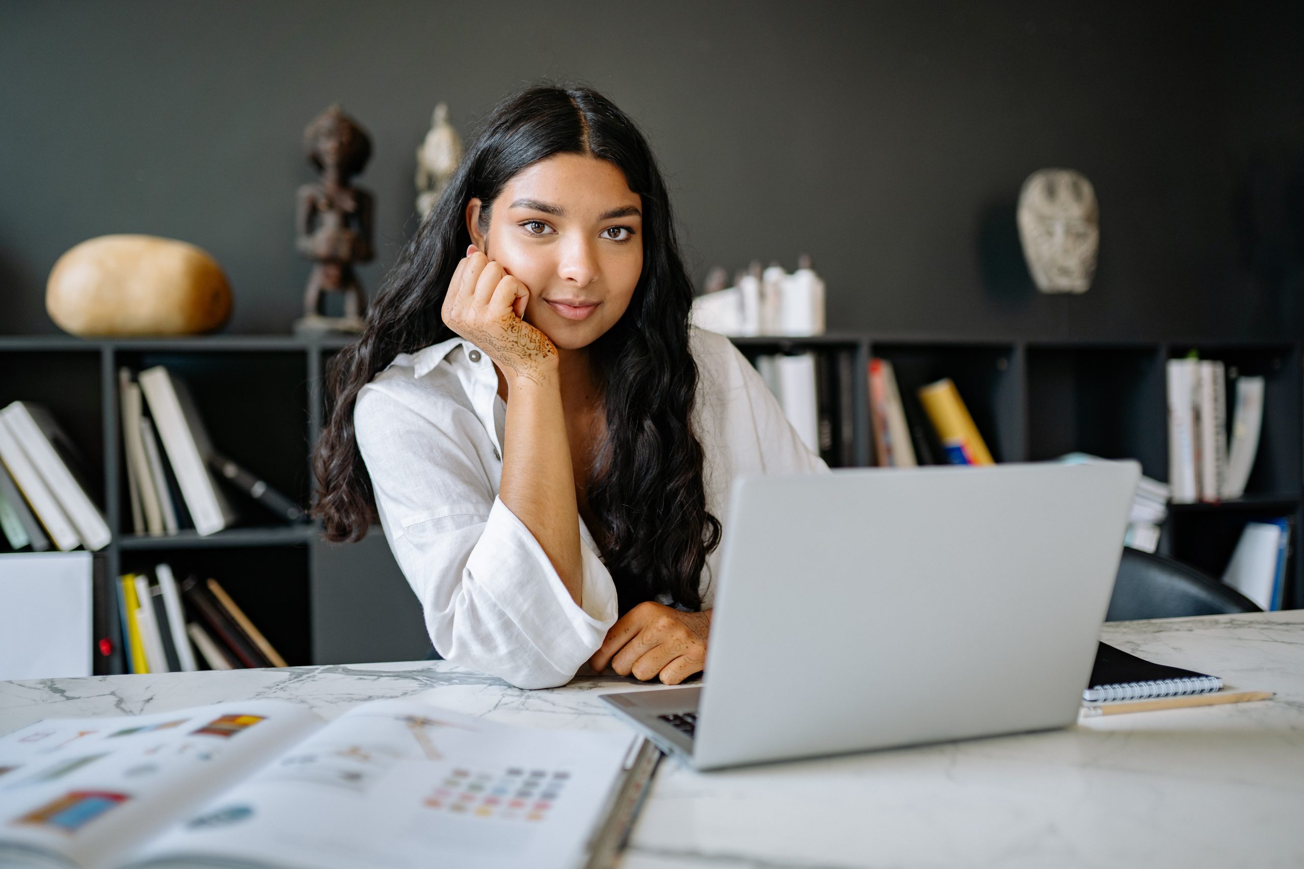 Teen in front of computer afford college