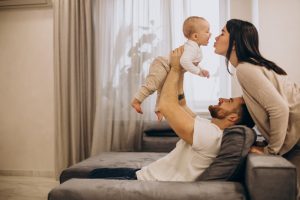 young family in home with baby