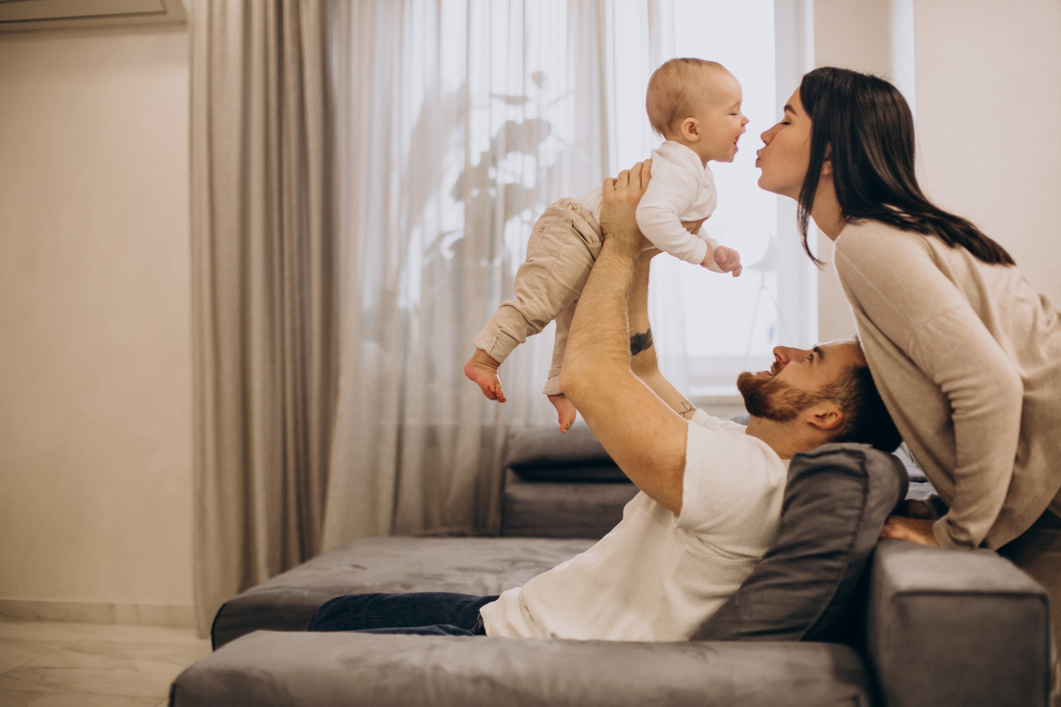 young family in home with baby