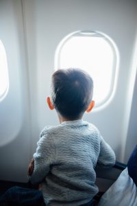 child in airplane seat