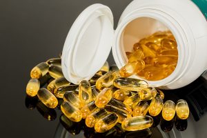 capsules in bottle on counter