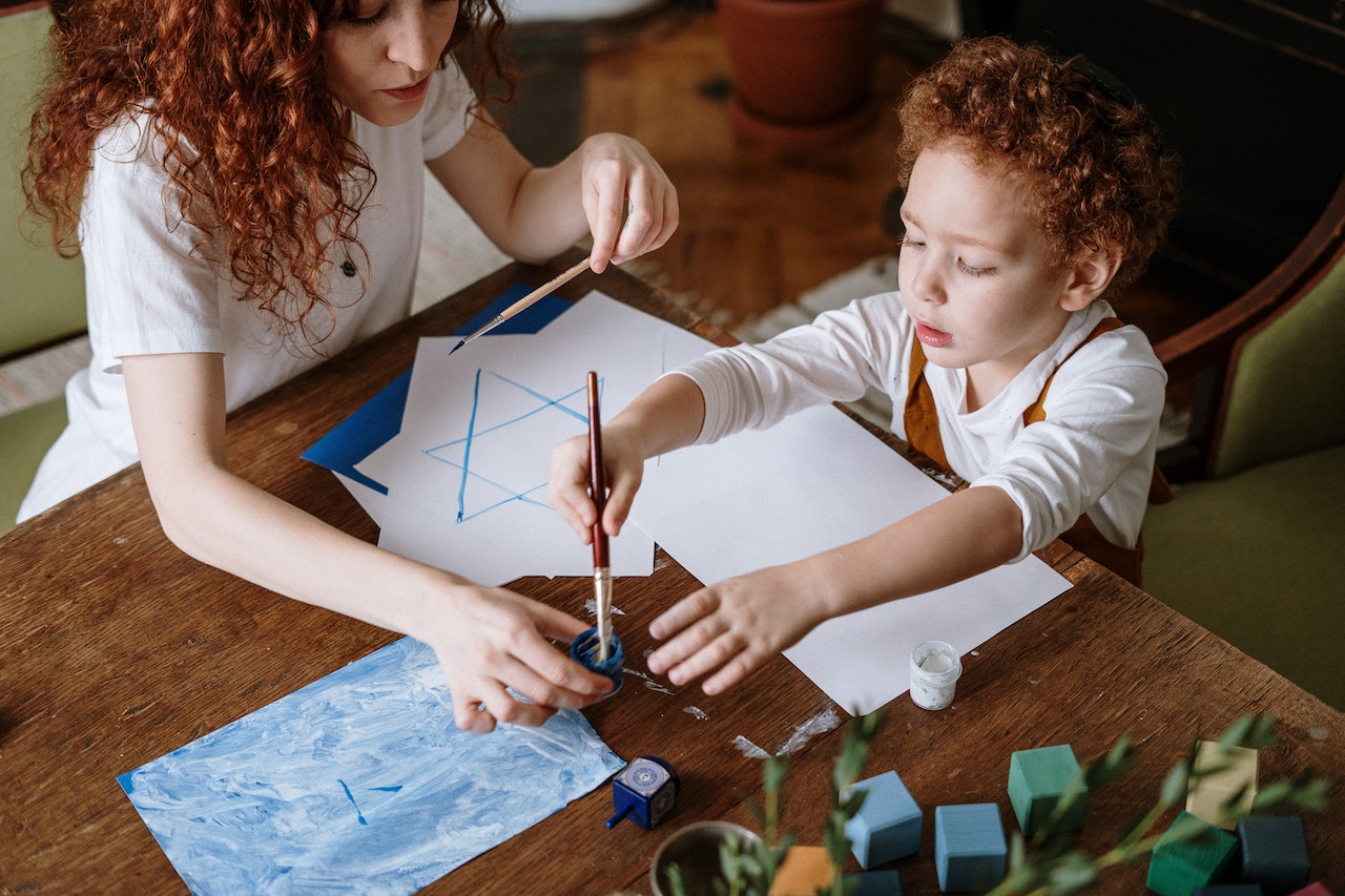 mom and son painting a picture