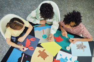 kids making origami