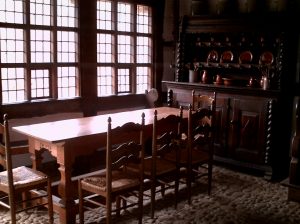 A kitchen with a table in front of a window
