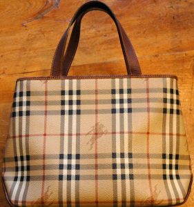 A woman hand bag on a wood floor