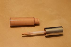 makeup concealer applicator and bottle