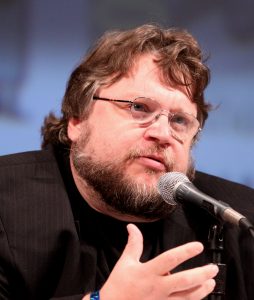 Guillermo del Toro talking into microphone