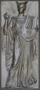 A person standing with an instrument
