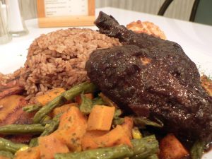 A plate of food with meat and vegetables