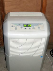 a dehumidifier sitting on ground