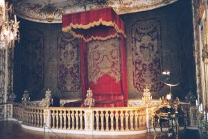 A large red bed in a castle