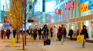 people in front of stores shopping