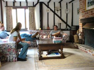 A group of people sitting around a living room