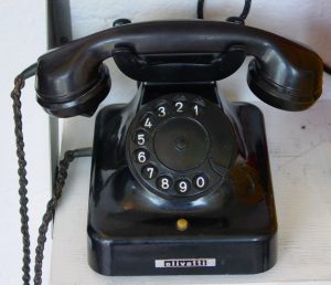 A black telephone on a table