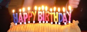 A birthday cake with lit candles