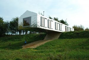 A building with a grassy field