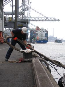 A man riding on the back of a boat