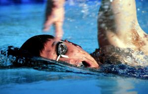 A person swimming in a body of water