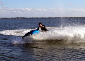 A man riding a wave on a surfboard in the water